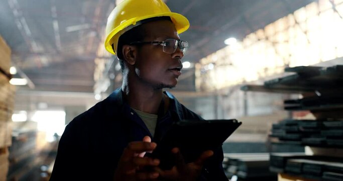 Black man, tablet and checklist at warehouse or factory to count stock or material. Logistics, supplier and employee with technology for manufacturing or distribution business to check information