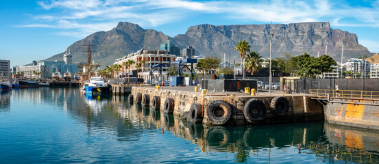 Fototapeta premium Victoria & Albert Water front with central Cape Town and Table Mountain in the background, South Africa