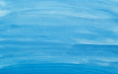 Abstract blue watercolor background. The color splashing on the paper. Hand drawn.