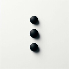 Three black dots arranged on a white background