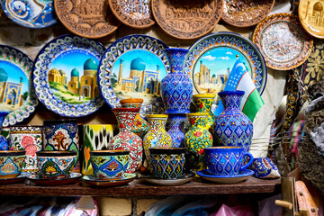 Decorative ceramic plates and cups in Uzbekistan - obrazy, fototapety, plakaty