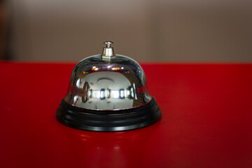 A front desk bell on reception counter. Hotel bell use to call staff service and staff can help...