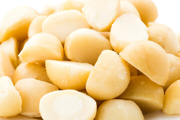 Close-up of macadamias on a white background.