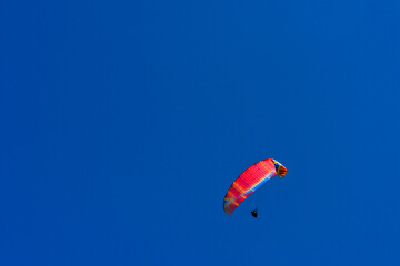 Paragliding extreme Sport with blue Sky and clouds in the background, Combining a Healthy Lifestyle and Freedom concept
