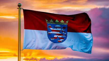 Hesse Waving Flag Against a Cloudy Sky at Sunset. - obrazy, fototapety, plakaty