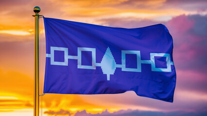 Iroquois Confederacy Waving Flag Against a Cloudy Sky at Sunset.