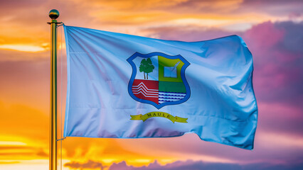 Maule Waving Flag Against a Cloudy Sky at Sunset.