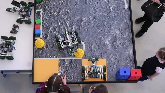 Robotics competitions, children control robots. High quality 4k footage