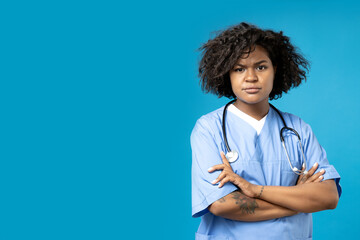 A young African American woman in a doctor's uniform