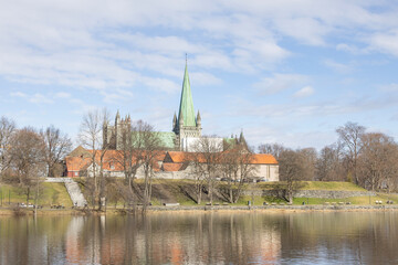 walking along nidelven (river) in a spring mood in trondheim city, trøndelag, nidelven, water, river, landscape, sky, nature, city, reflection, view, trees, clouds, travel, architecture, house, buildi - 782892155