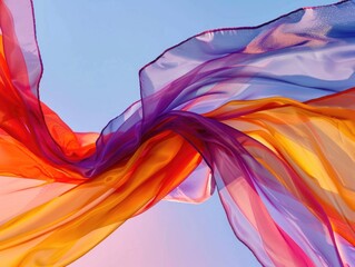 The flowing lines and vibrant colors of a silk scarf caught in a gentle breeze