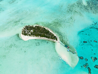 Aerial drone of island in the blue sea with a coral reef and the beach. Onok Island, Balabac, Philippines.