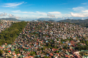 Fototapeta na wymiar Aerial drone of Baguio City with colorful houses in a mountainous province. Philippines, Luzon.