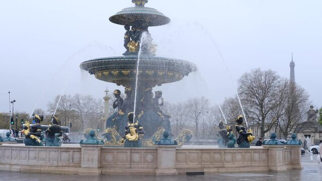 The fountain of the four Rivers on Concord Square on a cloudy day.  Paris, France - April 2, 2024: 