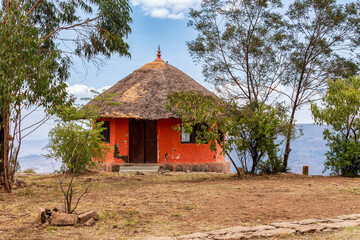 Beautiful colored traditional Ethiopian house, hut situated in mountain landscape near Debre Libanos, Oromia Region Ethiopia, Africa.