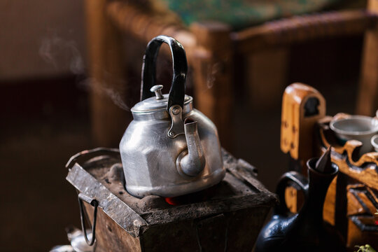 Ethiopian traditional coffee served with aromatic essence. Ceremony with Incense, frankincense and myrrh ignited by hot coal produce smoke that carries away bad any spirits. Debre Libanos, Ethiopia