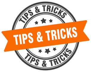 Obraz premium tips & tricks stamp. tips & tricks label on transparent background. round sign
