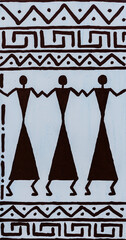 African drawing on a white wall with ornaments and figures of people, closeup - 782914395
