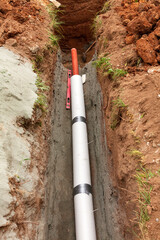 Installation of water main, sanitary sewer, storm drain systems, plastic pipes wrapped in insulation - 782917915