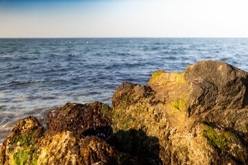 Shoreline of blue sea on a sunny day