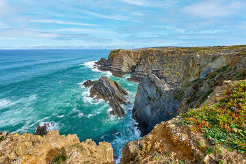 rocky cliffs at Cabo Raso, atlantic coast of Algarve, Portugal - 782924114