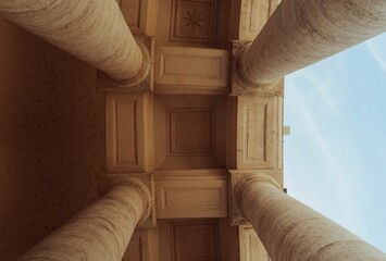 Low-angle shot of columns of an aged building