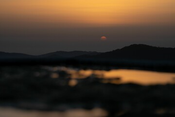 Mesmerizing view of a golden sunset over mountains