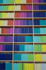Vertical shot of the shelves with colorful books. Green Square library. Sydney, Australia