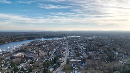 Drone shot of roads and houses near a river in Rhode Island, USA