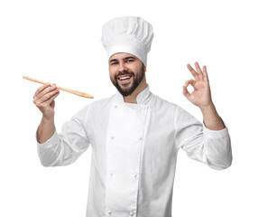Happy young chef in uniform tasting something and showing ok gesture on white background
