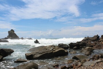 Beautiful shot of a seascape with rocks under the clouds