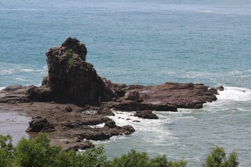 Beautiful shot of a seascape with rocks under the clouds