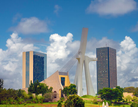 The modern skyline of the plateau district of Abidjan with St. Paul Cathedral in the foreground Abidjan, C&ocirc;te d'ivoire (Ivory Coast), West Africa