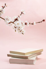 Apricot blossoms and books in spring