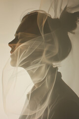 A woman's silhouette is shown with a veil of smoke surrounding her
