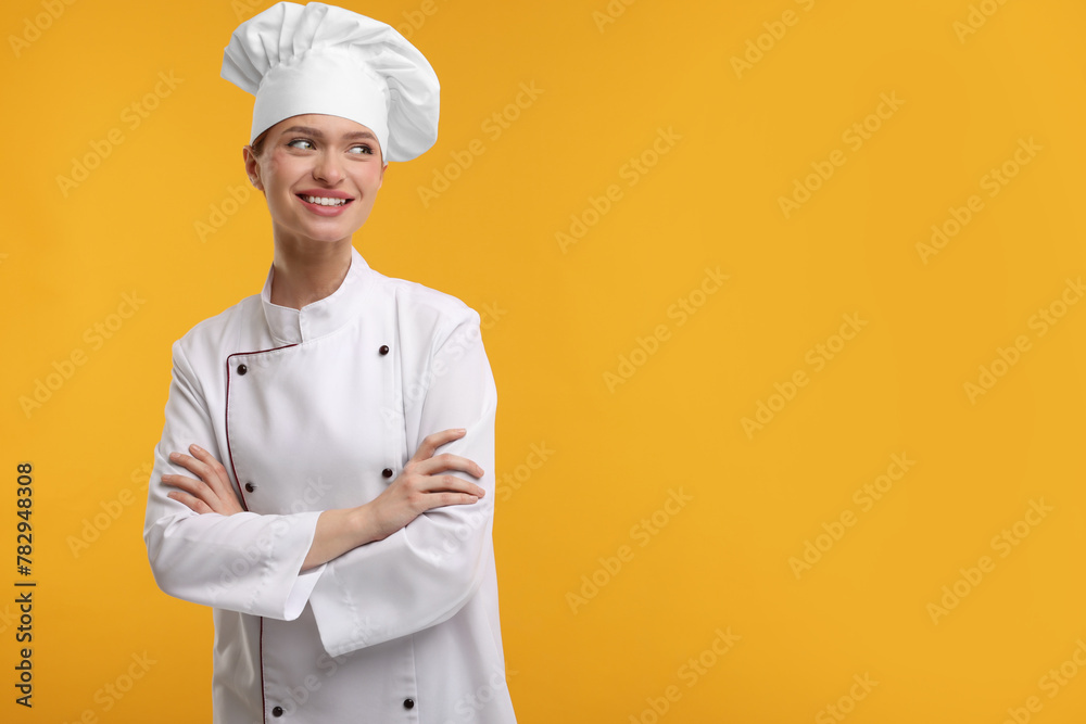 Poster Happy chef in uniform on orange background, space for text