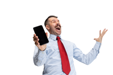 Surprised, embarrassed. Overjoyed young man in office clothes, manager with smartphone against transparent background. Concept of business, human emotions, facial expression, sales, ad