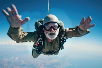 Fotobehang A man with a beard and goggles soaring through the air. Suitable for adventure and extreme sports concepts © Fotograf