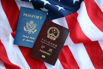Passport of China Republic with US Passport on United States of America folded flag close up