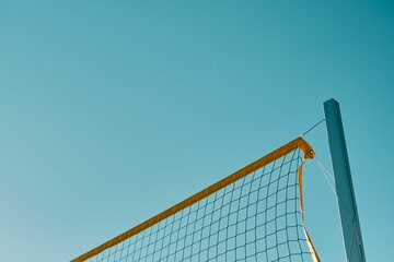 Beautiful view of a volleyball net with blue sky background