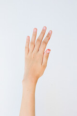 Teenager untidy hand above white background