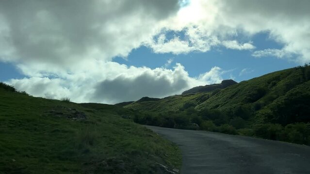 Car Point Of View, POV Driving Up Steep Winding Single Track Lane, Mountain Road With Sharp Bends From Eskdale Valley To Hardknott Pass In Cumbria, Lake District National Park.
