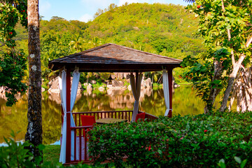 picturesque bright nature and pavilion in Seychelles, lake and granite stones