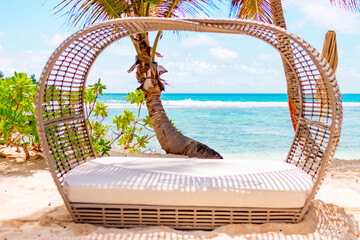 luxury sunbed on the ocean in a picturesque landscape in the Seychelles