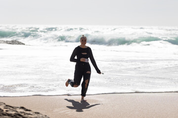 Happy woman Running on Beach