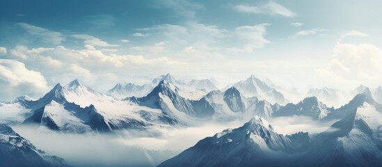 Fototapeta na wymiar High Alpine Peaks Covered in Snow Under Cloudy Sky