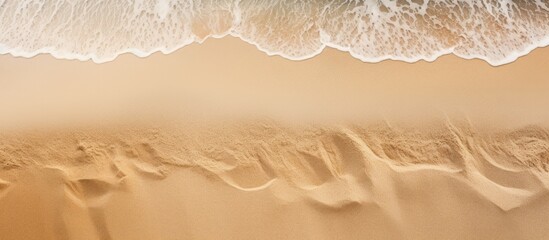 Wave approaching sandy beach - obrazy, fototapety, plakaty