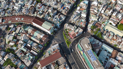 Amazing aerial view by drone of Ho Chi Minh, big Asian city, crowded townhouse, vehicle circulate...