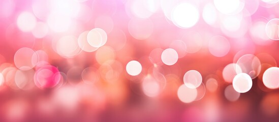 Blurred lights in pink and white on a soft focus backdrop