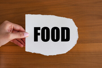 Food. Woman hand holds a piece of paper with a note, food. Eatable, meal, cuisine, cooking,...
